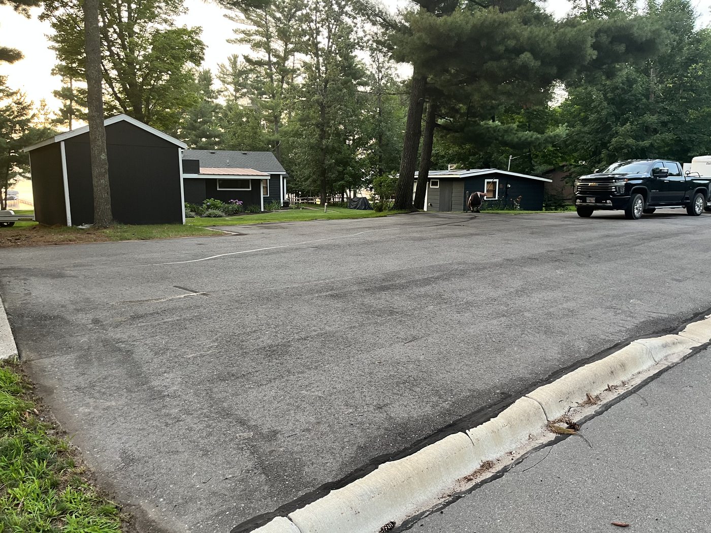 Fresh sealcoating on Minnesota lake cabin parking area
